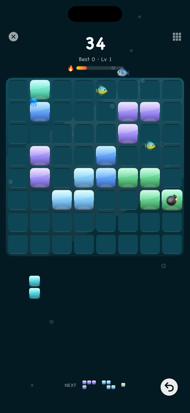 BlockPop gameplay in the Ocean theme with fish swimming past the board